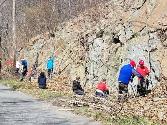 Boy Scouts uphold tradition, give back Scouts from Boy Scout Troop 95 cut away saplings on the access road to Camp Somers in Stanhope, during Beaver Day, Saturday, April 21 Photos by Mandy Coriston