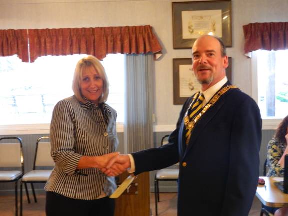 Elks help community Jamie Bernard from DASI and Tom Huhn Exalted Ruler of Sparta Elks