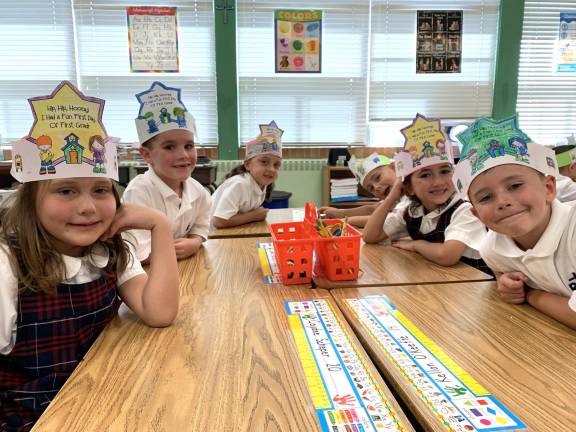 Children celebrate the 65th anniversary at school on Friday.