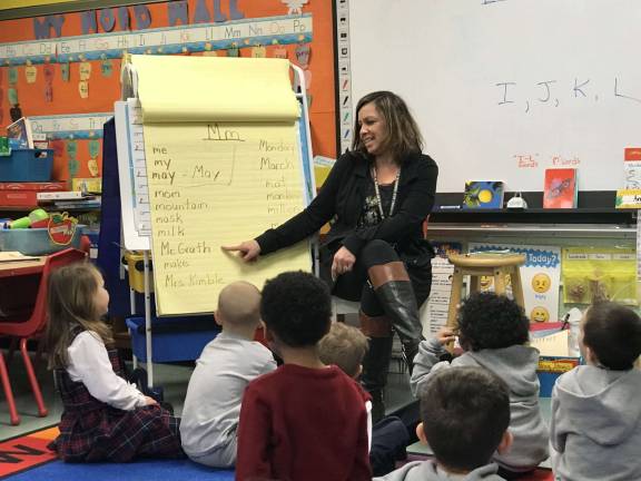School offers Early Childhood Development Program Mrs. Julie Kimble, center, teaches 4/5-year-old pre-kindergarten students the letter "m" and words associated with it Photo by Anthony Spaulding