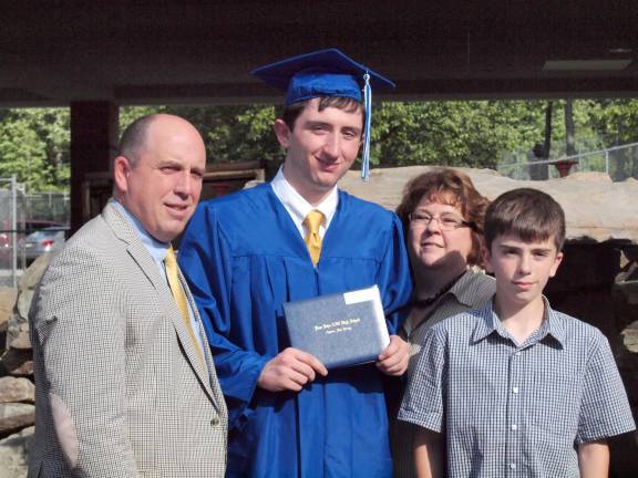 Pope John XXIII High School commencement Graduate Craig A. Tighe and his proud family