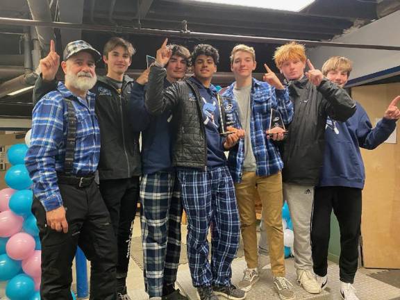 Coach Rodney Calafati, left, poses with the boys varsity ski team, from left, Drew Young, George Flint, Kanna Pasunuri, James Kressman, David Baker and Ryan Grycuk.