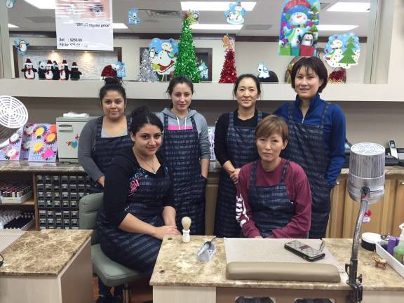 Recently renovated, Nail Q reopens for business The Nail Q team. Back row: Elsa, Kelly, Amy and Tina. Front: Bianca and Susan.