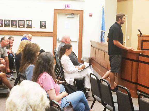 Photo by Gretchen van Nuys Mountain-biker Jeff Lenosky addresses the Township Council on June 28 in opposition to the proposed skateoarding ban.