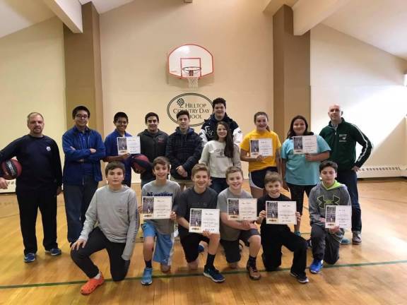 Members of the Saint Kateri Knights of Columbus, Columbian Squires, and Squire Roses celebrate at a previous free throw championship.