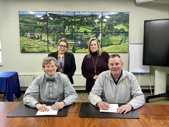 SCCC, Sussex Tech reach deal Seated are Jon Connolly, president of Sussex County Community College, left, and Gus Modla, superintendent/principal of Sussex County Technical School, Standing are Kathleen Okay, SCCC senior vice president of academic and student affairs, left, and Suzan Melik, SCCC supervisor, Allied Health Programs. (Photo provided)