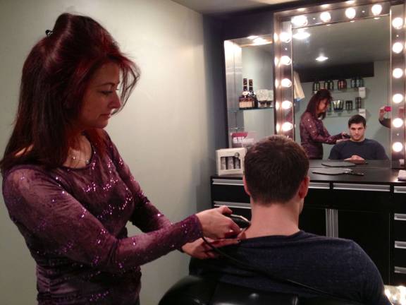 Bella Boutique targets male customers Susan Ayres and a client in the Men's Room of Bella Boutique