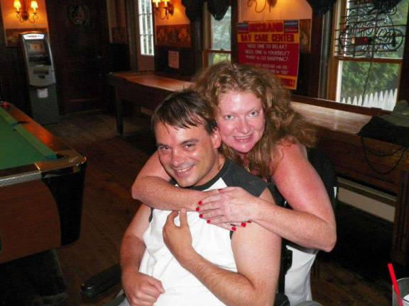 Jammin' for brain injury victims Close friends Scott Harris and Erin Braun at the Village Saloon in Sparta.