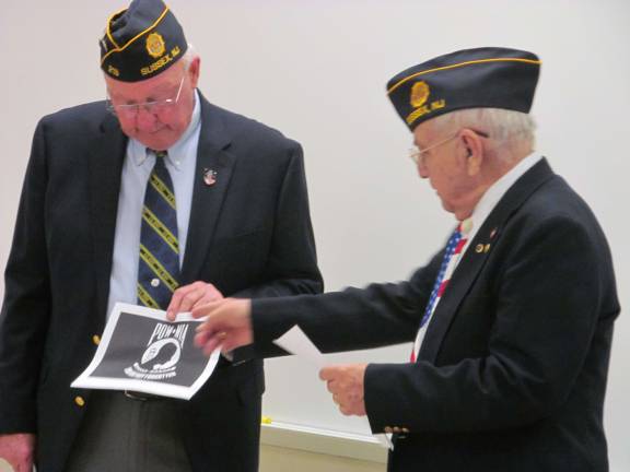 Veterans bring history alive for high school students Douglas Cherkas and William Aukema explain the significance of the POW MIA flag