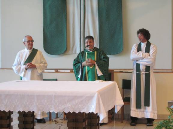 Last mass in Sparta for Father Rivera Father Raimundo Rivera (center) enjoys a moment of happiness during his final mass at St. Kateri parish along with Deacon Drew Calandriello, left, and Pastor Father Tom Fallone.