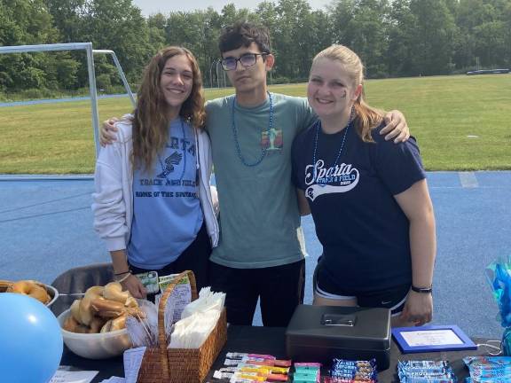 From left are student volunteers Ashley Grene, 17; Mathew Vassalo, 16; andAnna Yerofeye, 17.