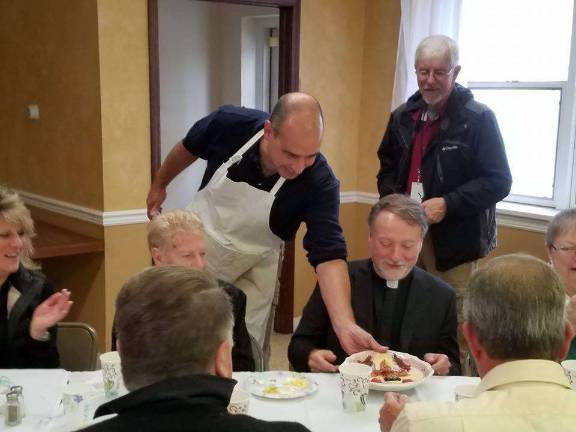 Beloved priest celebrates 30 years Rev. Robert Griner is served a special breakfast in the form of a cross to kick off the celebration of his 30 years as a priest. PHOTO BY LAURIE GORDON