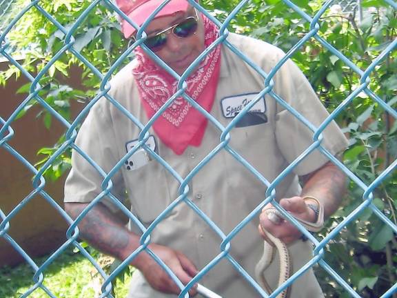 Parker Space talks about one of the reptiles in the snake pit (Photo by Janet Redyke)