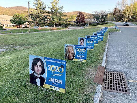 Each “We Rise!” sign includes the name and photo of a member of the Class of 2020. (Photo provided)