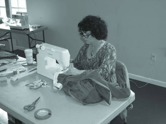 Locals star in Rudolph Sue Brizek of Sparta busy in the costume department.
