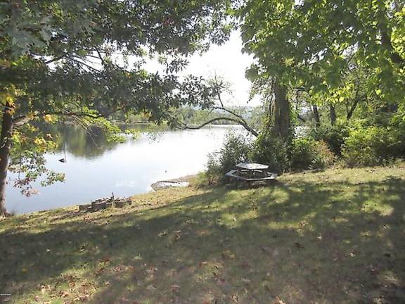 Enjoy fishing and kayaking from your updated riverfront home