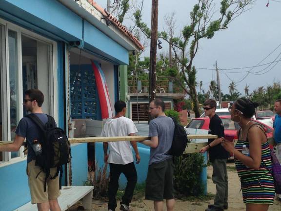 Traveling to Vieques after Hurricane Maria William Paterson students (Thomas Smith, Richard Potenza, Matthew Mullins, Shaney Lara) assist in a delivery of new lumber to help rebuild a kitchen.