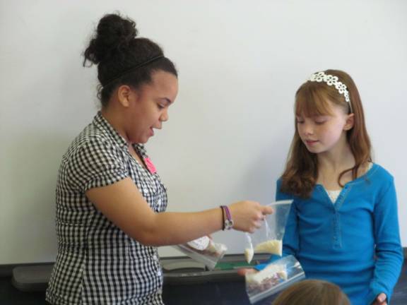 Lessons on growing up Laura Silverio makes a presentation to an Alpine fifth grader