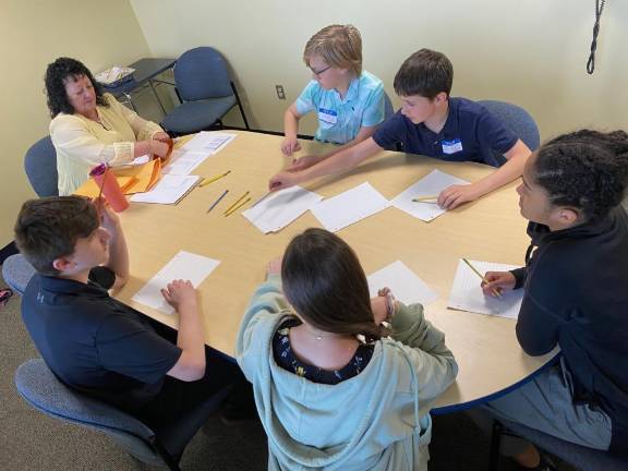 Clockwise are Jake Hamilton, Charles Scholl, Victoria Tynes, Sara Schwarz and Logan Fadil during the collaborative round of the competition.