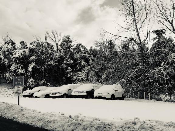 Storm warning: It's mostly about the ice Some local areas will get more than a quarter of an inch of ice Monday into Tuesday. It's especially concerning for areas where trees were already damaged or weighed down by last week's storm. Pictured: Vehicles in Andover Township's lot during last week's storm.