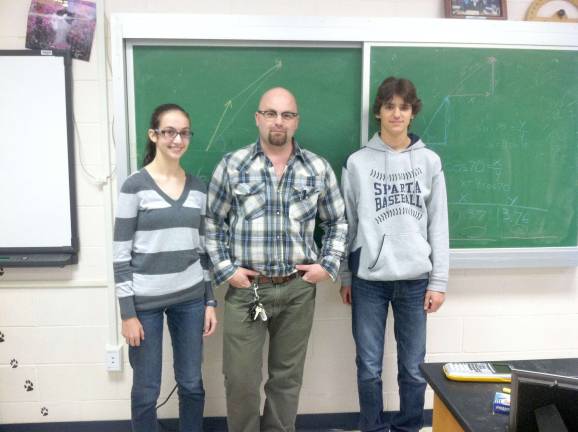 Sparta High School Science Classes excel James Jarrell with students Steve Viola and Veronica LaBelle, who took the AP Physics Exam