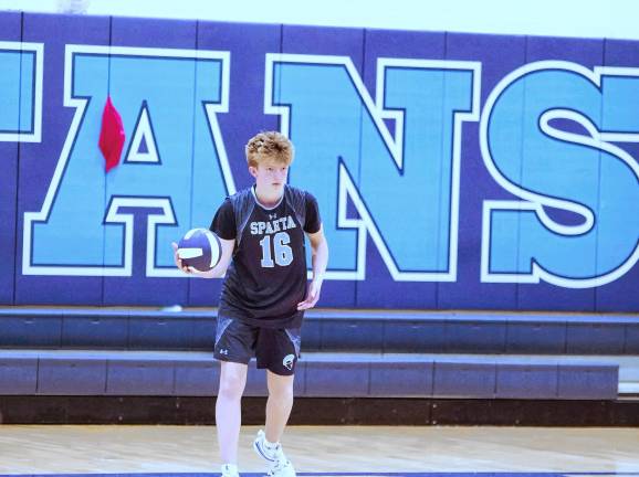 Sports roundup: Pope John wins H/W/S title Sparta's Aiden Foy is about to execute a serve.