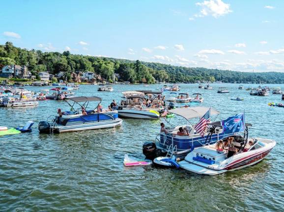 FloatFest 2024 Many listen to the bands perform from boats on Lake Mohawk.