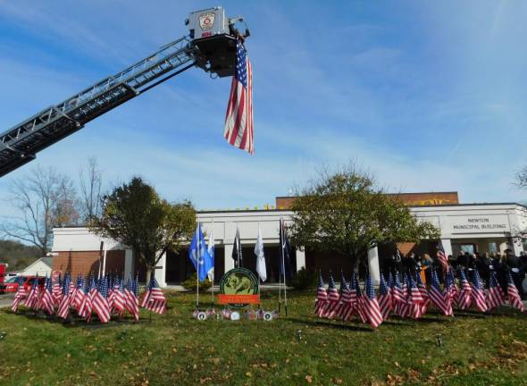 Flags of Newton Veterans and flag sponsors gather to celebrate Flags of Honor at the Newton Municipal Building on Saturday, Nov 9, 2019.