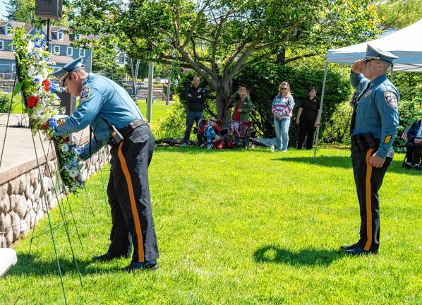 Photos: Memorial Day Parade A Sparta police officer places a wreath during the Memorial Day ceremony.