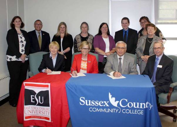 Photo provided Administrators and faculty members from East Stroudsburg University (ESU) and Sussex County Community College (SCCC) participated in an articulation agreement signing ceremony on May 11 at SCCC. Seated from left to right are: Joanne Zakartha Bruno, J.D., provost and vice president of academic affairs at ESU, Marcia G. Welsh, Ph.D., president of ESU, Paul Mazur, Ph.D., president of SCCC, and William Waite, vice president of academic affairs at SCCC. Standing from left to right are: Candice Pellegrino, assistant registrar for transfer articulation at ESU, Robert Fleischman, J.D., Ed.D., dean of the college of business and management at ESU, Kathleen Okay, dean at SCCC, Naomi Miller, professor of psychology at SCCC, Deborah McFadden, vice president of student affairs at SCCC, Scott Scardena,, transfer counselor at SCCC, Nancy Gallo, professor of legal studies at SCCC, and Alberta Jaeger, associate dean of academic affairs at SCCC.