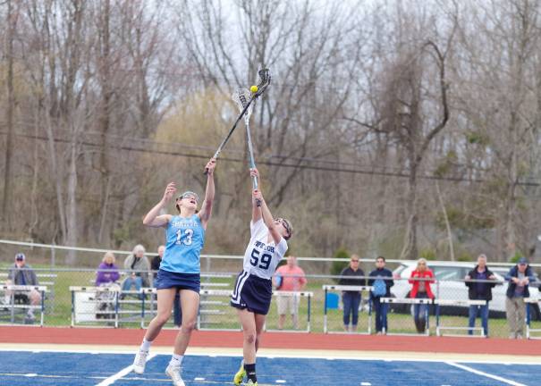 Mead leads Sparta girls to lacrosse victory over Pope John Sparta's Kaitlin Mead snags the ball with her crosse as Pope John's Maria Oliva makes a try. Mead led Sparta with 4 goals. Oliva had 4 goals for Pope John.