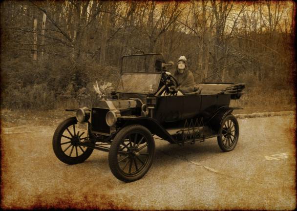 Students photograph classic car in antiquing project Students photograph classic car in antiquing project