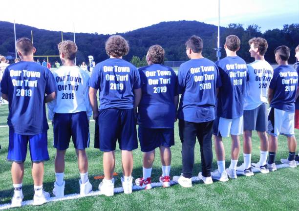 Sparta High School athletes wore Our Town, Our Turf, T-shirts at the ribbon cutting for the new $3.5-million dollar football field on Monday, Aug. 26, 2019.