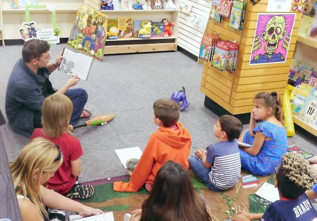 Max Brallier reads to young fans from his new book The Last Kids on Earth and the Midnight Blade at Sparta Books on Tuesday, Sep 17, 2019. Brallier visited Sparta to celebrate the debut of the book and the Netflix show based on his Last Kids on Earth series.