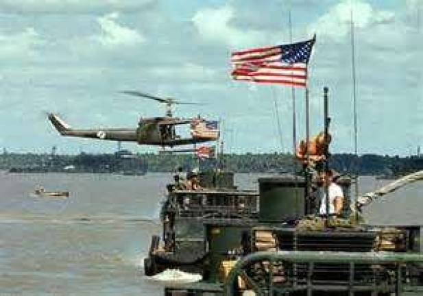 Helicopter landing in the Mekong Delta. photo by mike rahill
