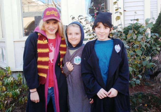 Pottermania comes to Newton Siblings Abigail, Sam, and James Rabbitt of Newton – dressed up as Gryffindor, Slytherin, and Ravenclaw students, respectively.