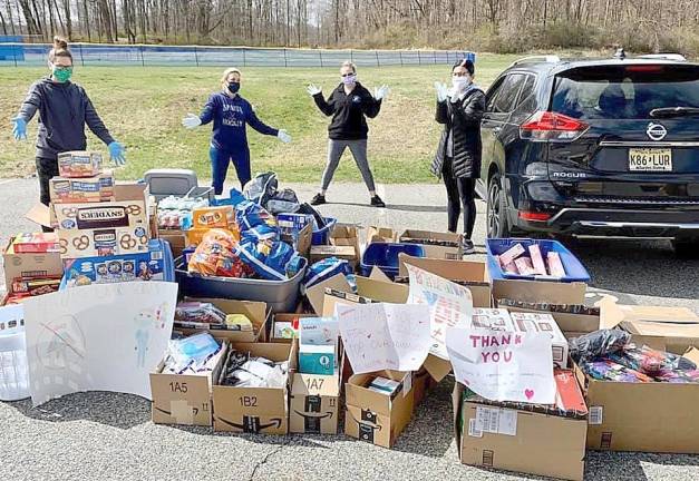 The (socially distanced) distribution of items at the Sparta High School parking lot