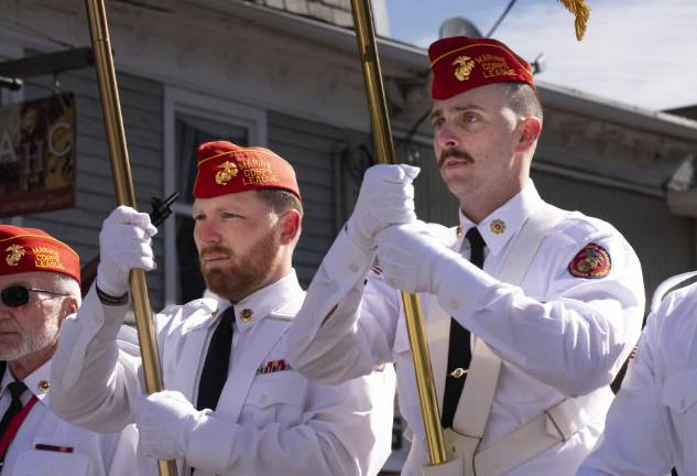 Members of the Marine Corps League march in the parade.