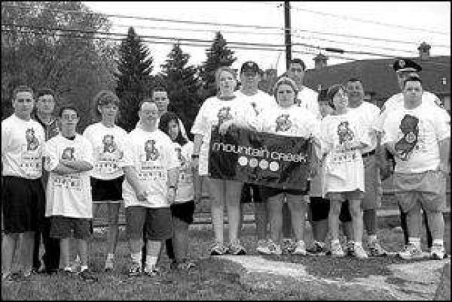 Vernon police officers carry the torch for Special Olympics Vernon police officers carry the torch for Special Olympics