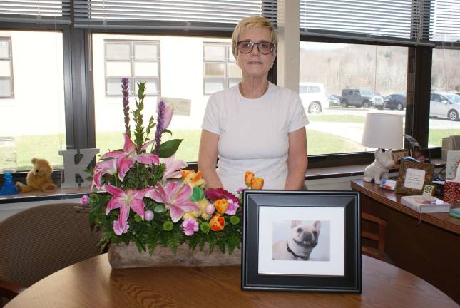 The therapy dog is dead: Long live the therapy dog Kacey Dalton with a photograph of her beloved Franc