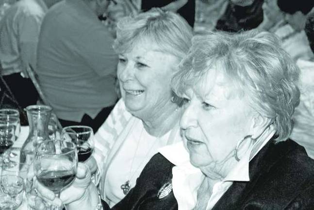 Library holds wine tasting Barbara Kovalsky and Nancy Hooks.