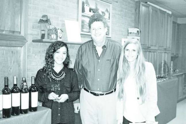 Library holds wine tasting Noelia Marchetti, Randy Burke and Mariajose Feuereisen.