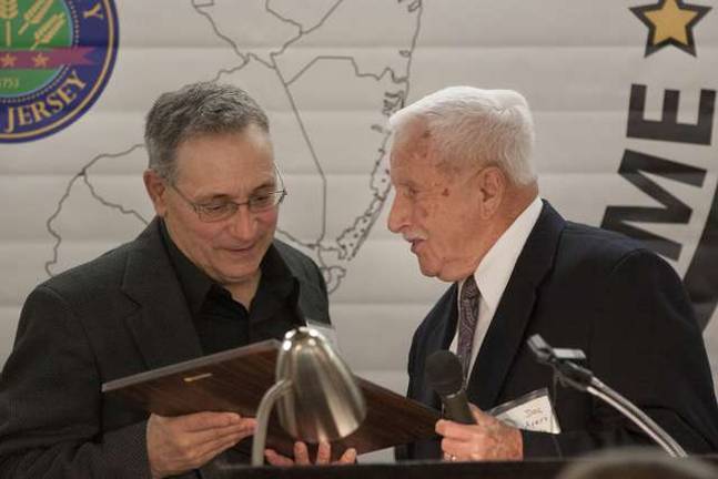 The chosen few Class of 2014 Louis Frato accepts his plaque from Dolson "Doc" Ayers during the induction dinner into the Sussex County Sports Hall of Fame Class of 2014.