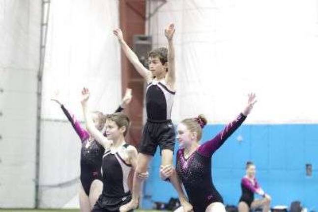 'Wild About Power' meet Berks East Gymnastics team members Colin Noble, Logan Halliday and Nicole Lockey during a performance. Berks East Gymnastics is located in Parker Ford Pennsylvania.