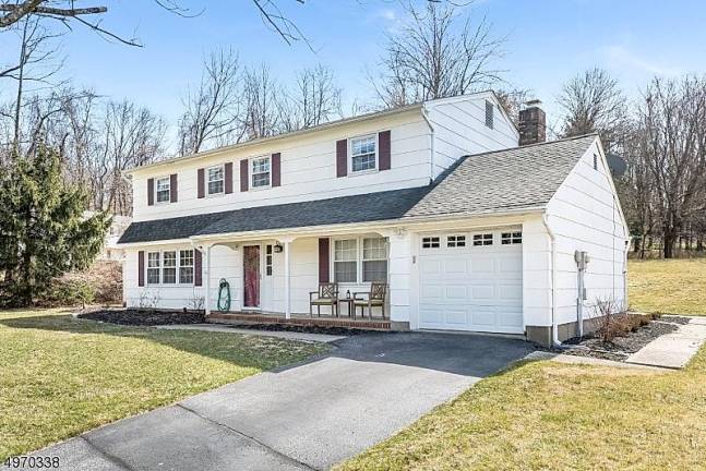 Updated colonial is set on a secluded half-acre