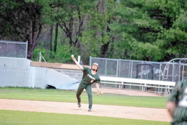 Sussex Tech shortstop Dylan Crane throws toward first base.