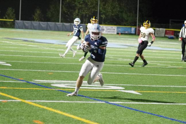 Sparta wide receiver Nicholas Curry runs with the ball. Curry scored one touchdown in the game.