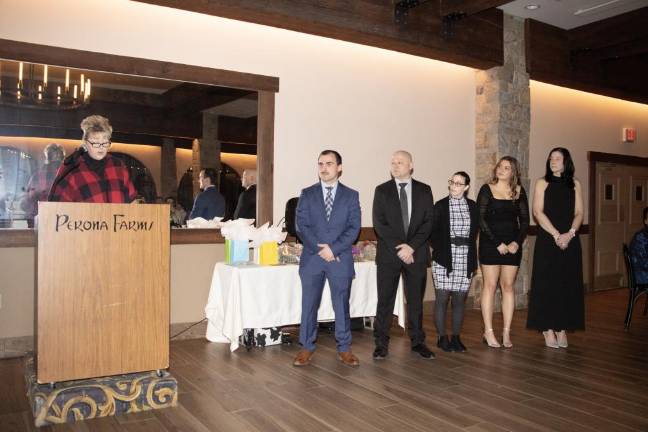 Councilwoman Christine Quinn, left, speaks at the Sparta Ambulance Squad’s installation dinner Saturday, Jan. 20. The squad’s officers, from left, are Capt. Max Merlino, 1st Lt. Benjamin Wright, 2nd Lt. Alexandra Castiglia, Sgt. Aubrey Coombs and trustee Allyson Wright. Trustee Bradley Erickson was unable to attend the dinner. (Photos by Dave Smith)