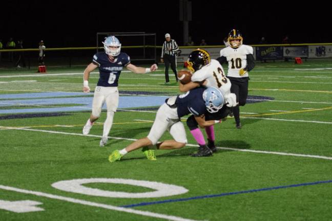 After catching the ball, West Milford wide receiver Jake Schwarzlow is taken down by a Sparta defender in the first half of the game Friday, Oct. 13.