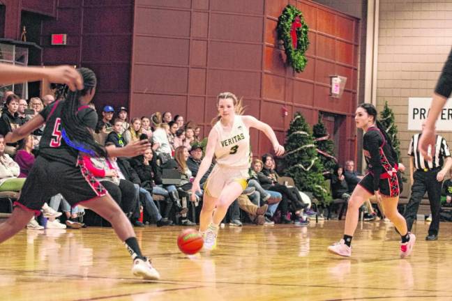 Veritas guard Caitlin O'Malley dribbles the ball in the Dec. 21 game against Harmony Christian of New York. Veritas won, 73-29, and O'Malley scored 17 points. (Photo by George Leroy Hunter)